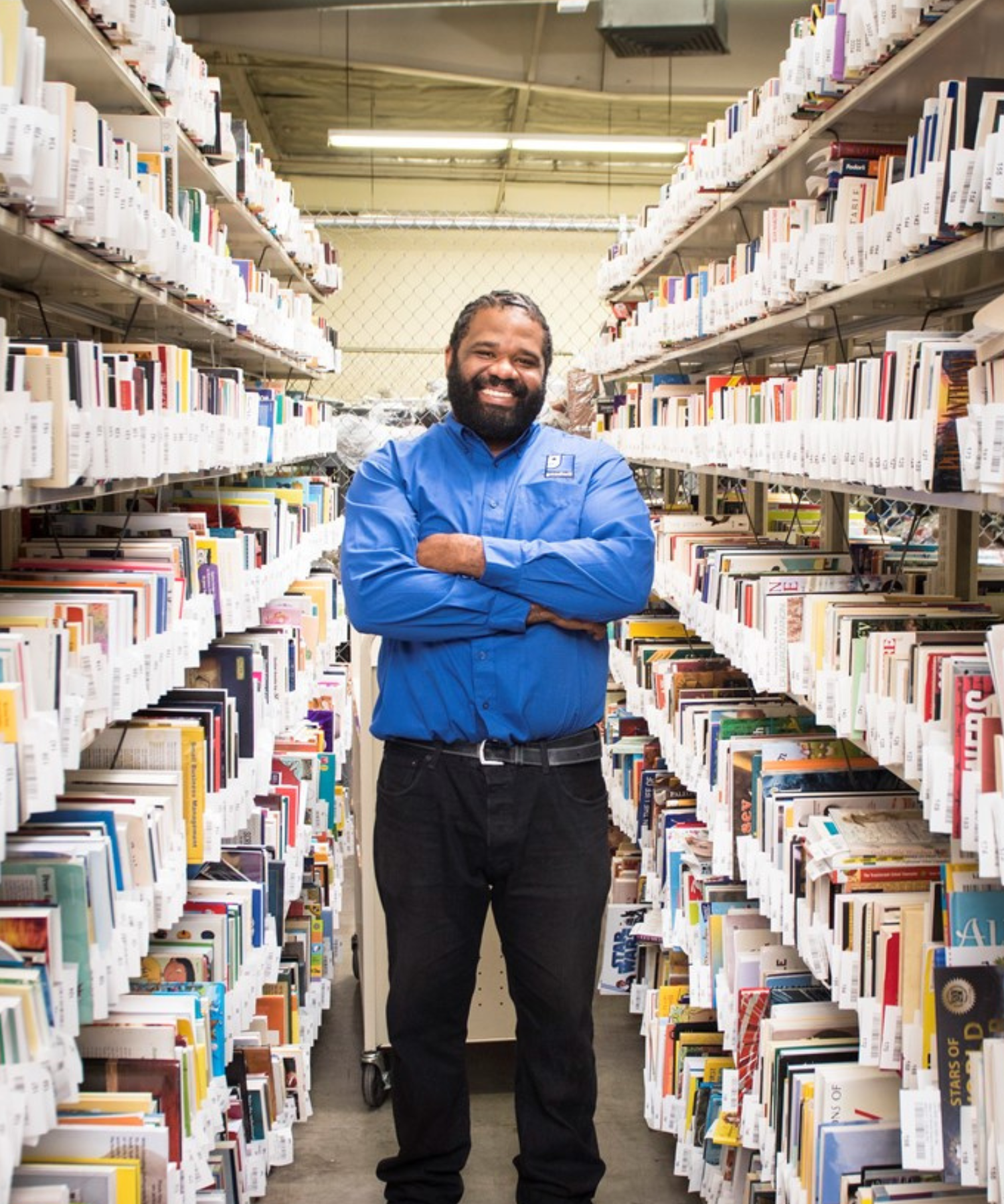 Man standing in library Man standing in library