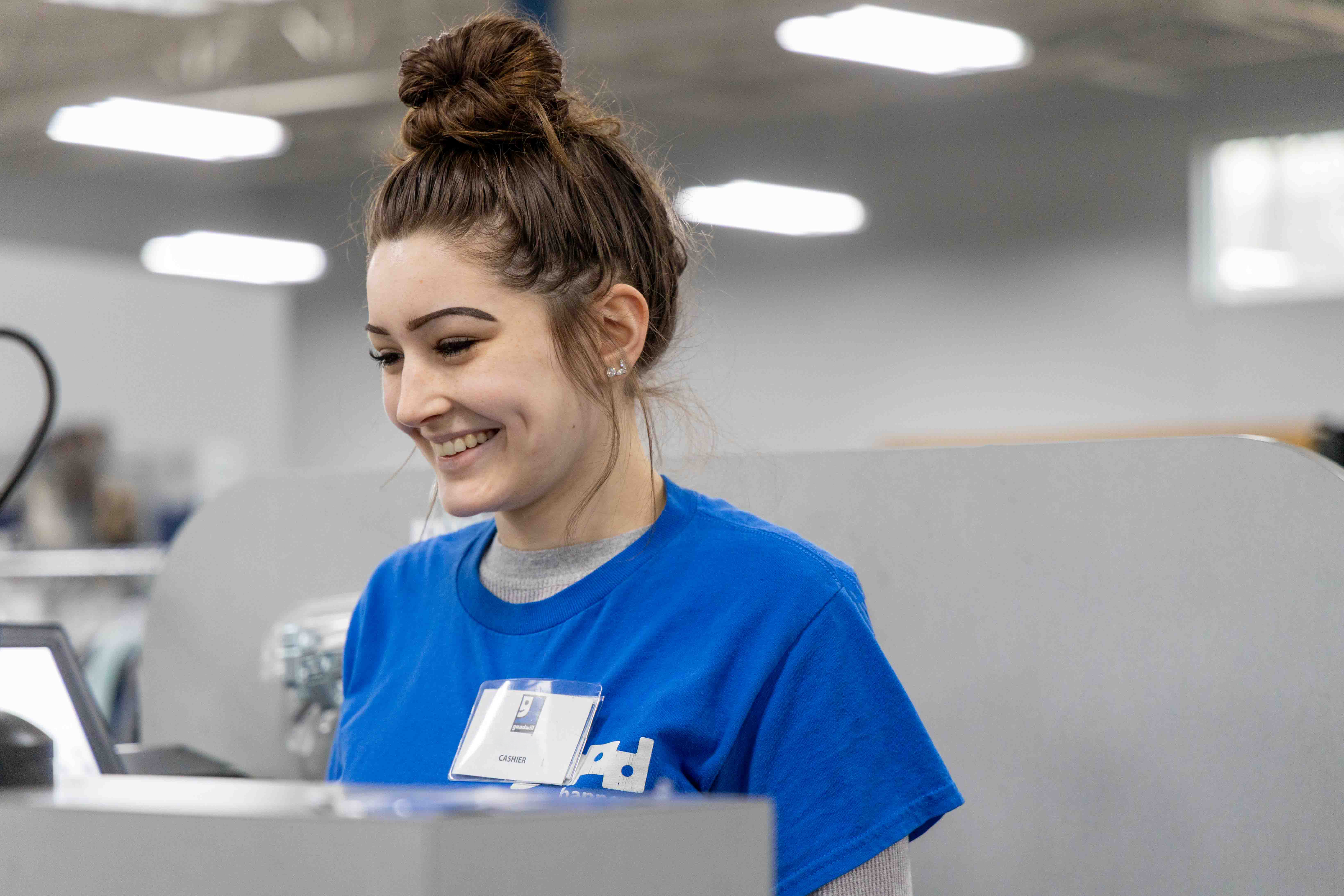 cashier female cashier at Goodwill store