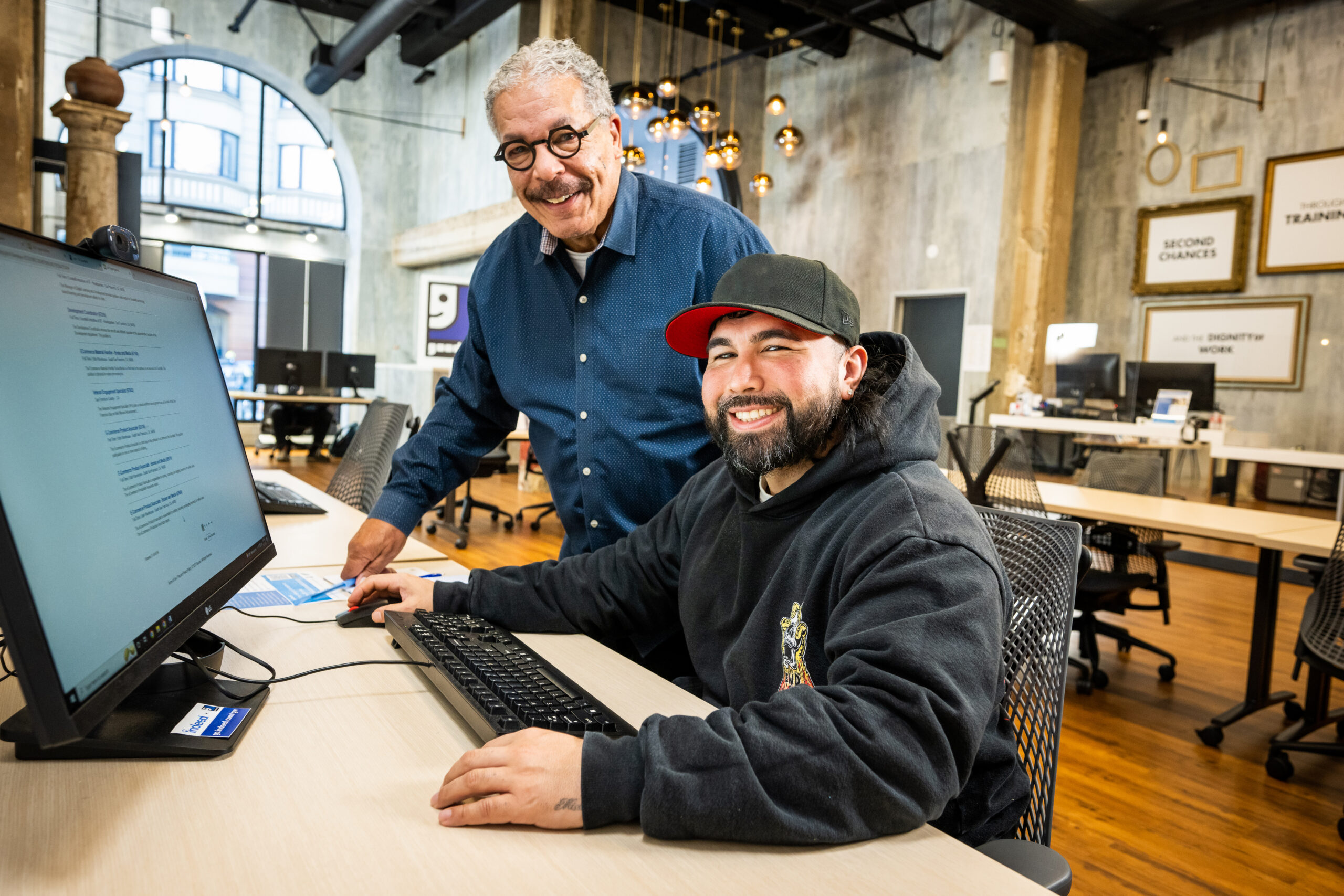 Two men by computer